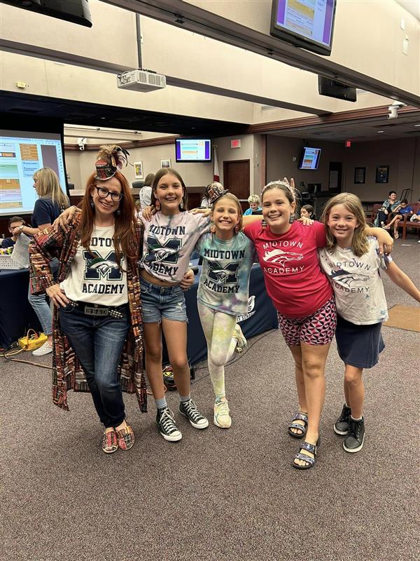 Midtown's Battle of the Books Team with Coach Ms. Myers at the Finals